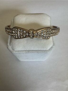 Gold tone and rhinestone slip on Bow Bracelet